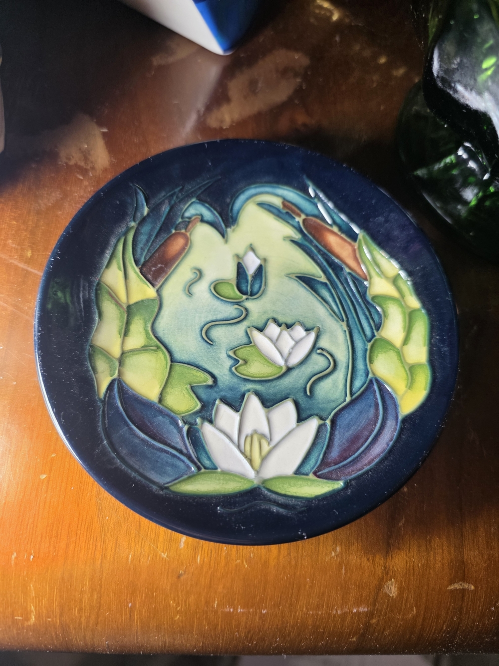Moorcroft "Lamia" pattern ceramic pin dish featuring hand-painted water lily